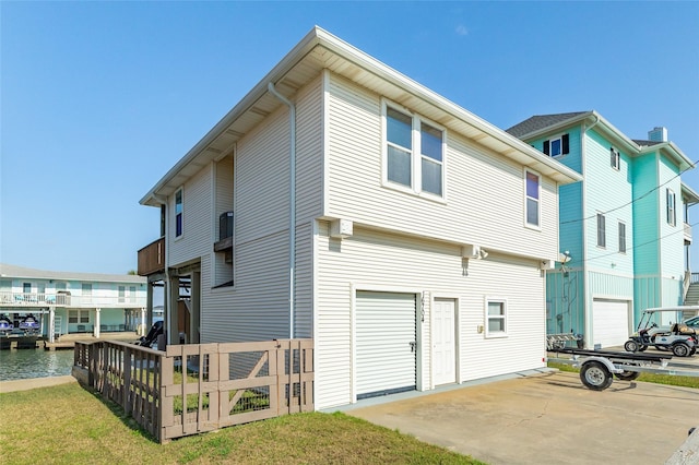 back of house featuring a garage