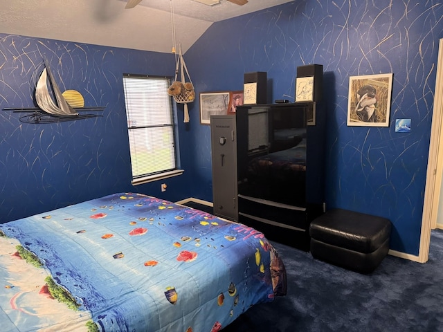 bedroom with ceiling fan, carpet flooring, and lofted ceiling