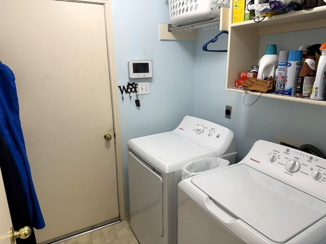 laundry area with independent washer and dryer