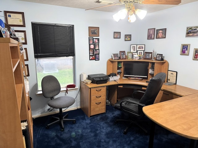 carpeted home office with ceiling fan