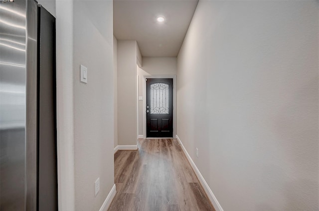 entryway with hardwood / wood-style floors