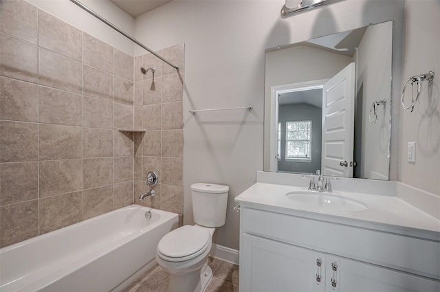 full bathroom with vanity, tiled shower / bath, and toilet