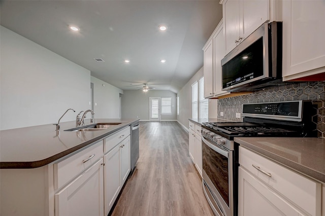 kitchen featuring white cabinetry, appliances with stainless steel finishes, and sink