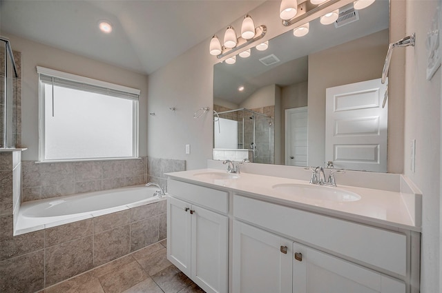 bathroom with vanity, tile patterned flooring, vaulted ceiling, and shower with separate bathtub