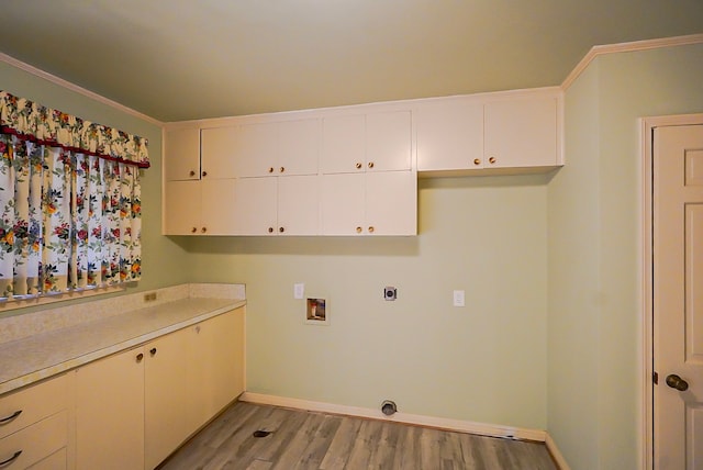 washroom featuring light wood-type flooring, cabinets, hookup for an electric dryer, and hookup for a washing machine