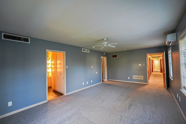 spare room featuring light colored carpet and ceiling fan