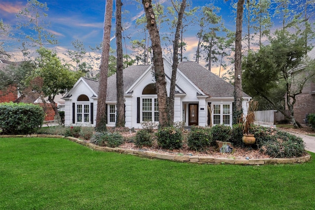 view of front of home with a lawn