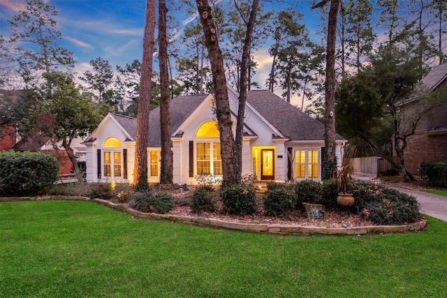 front facade with a yard