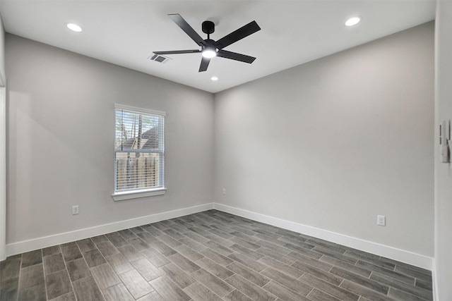 unfurnished room featuring ceiling fan and dark wood-type flooring