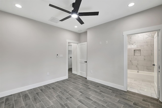 unfurnished bedroom with ceiling fan and ensuite bath