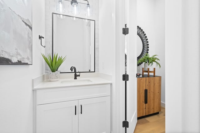 bathroom featuring wood finished floors and vanity