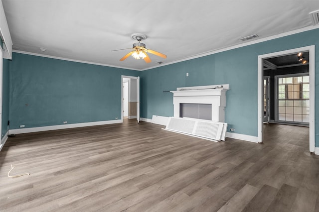 unfurnished living room with ceiling fan, wood-type flooring, ornamental molding, and a fireplace