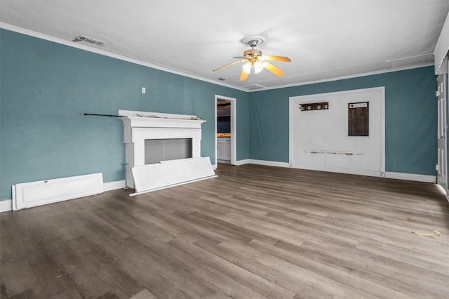 unfurnished living room featuring a fireplace, hardwood / wood-style flooring, crown molding, and ceiling fan