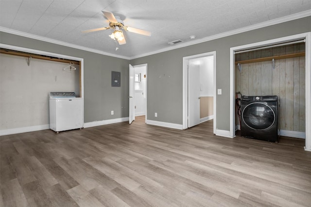 unfurnished bedroom with ceiling fan, electric panel, crown molding, and light hardwood / wood-style floors