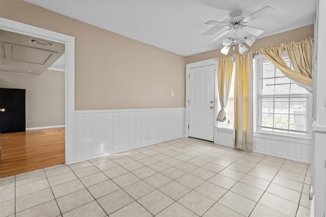 unfurnished room featuring ceiling fan and light tile patterned floors