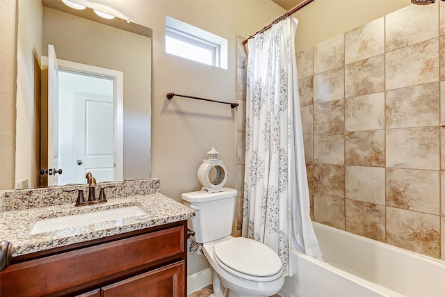 bathroom featuring shower / tub combo, vanity, and toilet