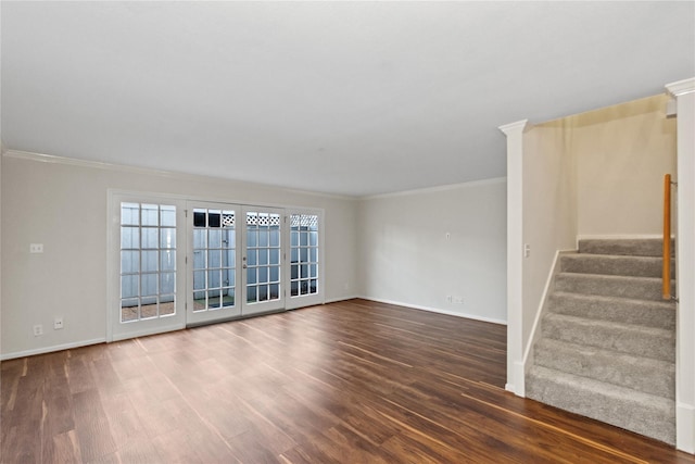 unfurnished living room with dark hardwood / wood-style flooring, crown molding, and french doors