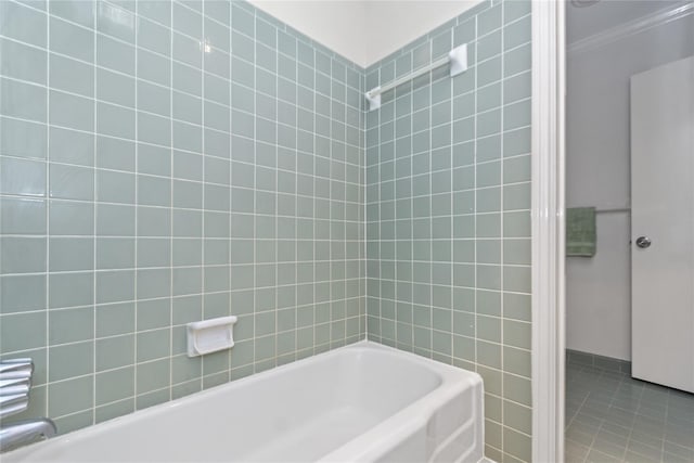 bathroom featuring tile patterned flooring, shower / washtub combination, and ornamental molding