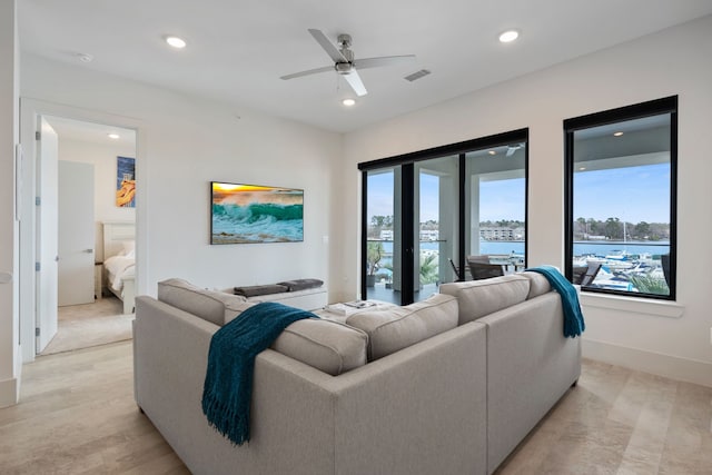 living area with baseboards, visible vents, a ceiling fan, light wood-style floors, and recessed lighting