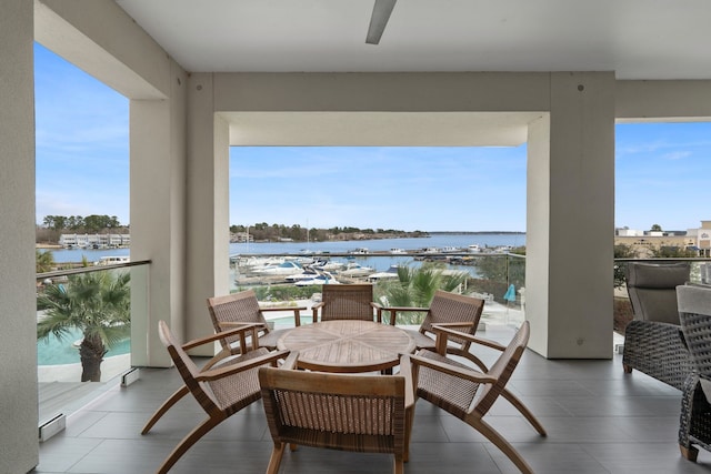 balcony featuring a water view