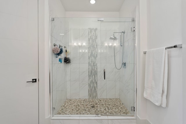 bathroom with a shower stall