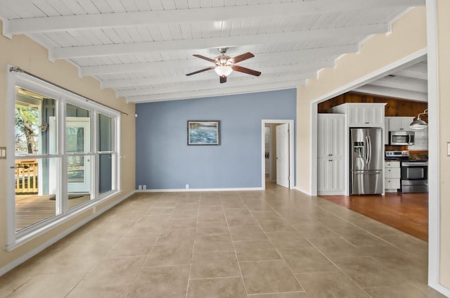 tiled spare room with ceiling fan and lofted ceiling with beams