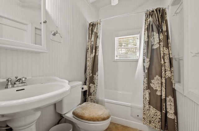 full bathroom with sink, shower / tub combo, and toilet