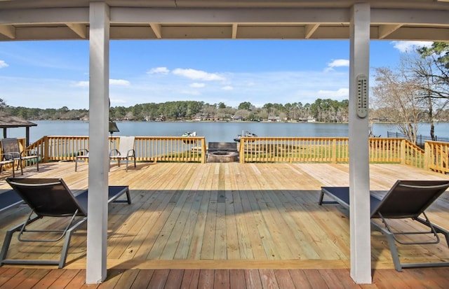 wooden terrace with a water view