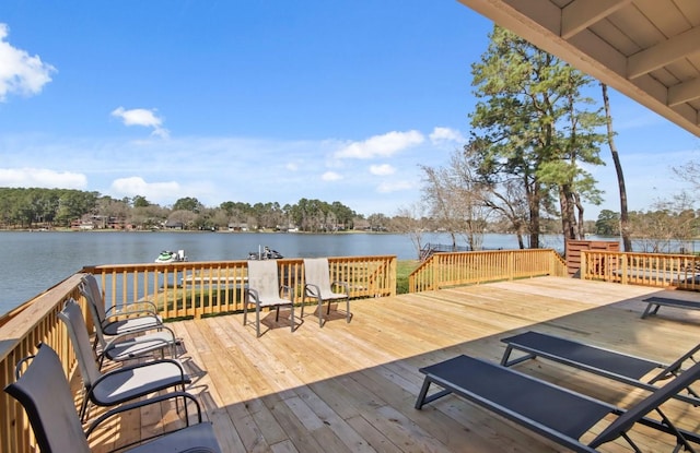 wooden deck with a water view