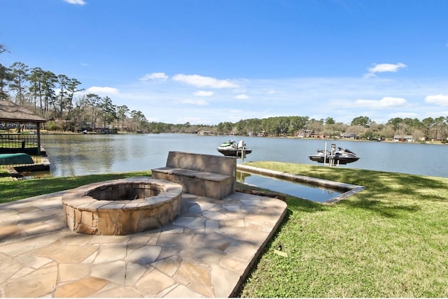 view of patio featuring a water view, an outdoor fire pit, and a gazebo