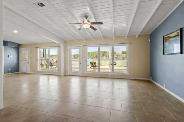 unfurnished room featuring light tile patterned floors, ceiling fan, and beam ceiling