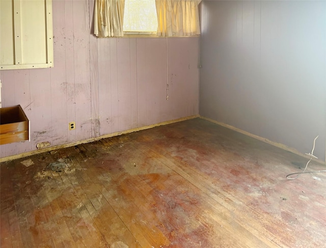 602 Brightwood Pl, San Antonio, TX 78209 - basement featuring hardwood / wood-style floors and wood walls