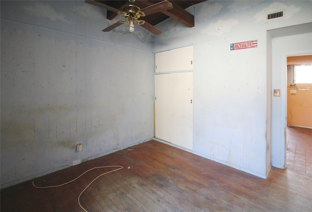 602 Brightwood Pl, San Antonio, TX 78209 - unfurnished room featuring ceiling fan, wood-type flooring, and beamed ceiling