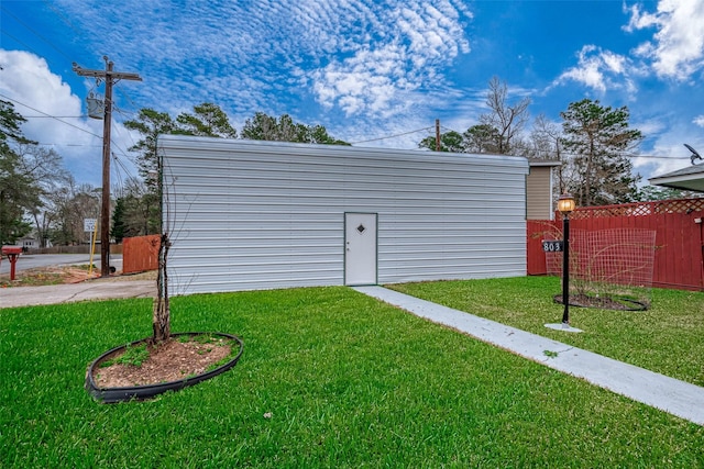 view of outdoor structure featuring fence