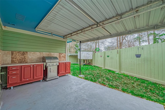 view of patio featuring a fenced backyard and grilling area