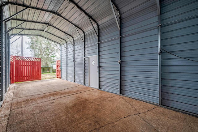 garage featuring a detached carport