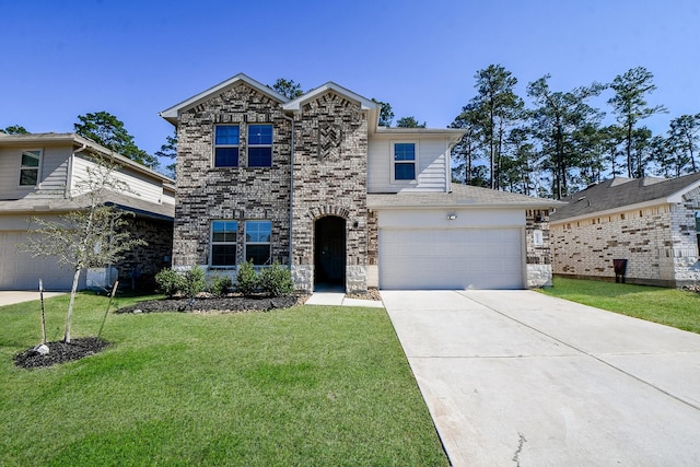 view of property with a front yard and a garage