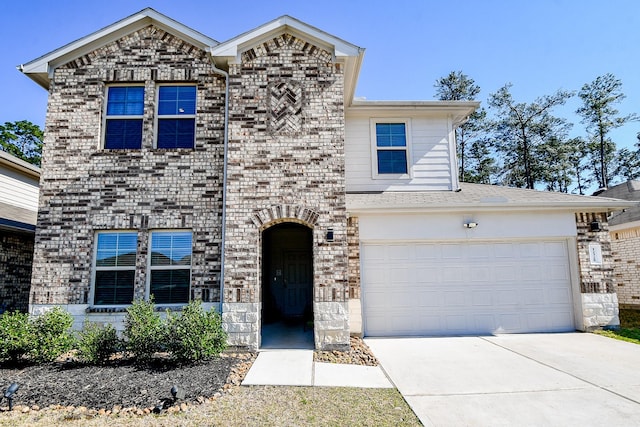 view of front of property with a garage