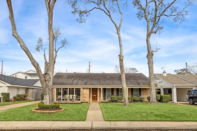 ranch-style home with a front lawn