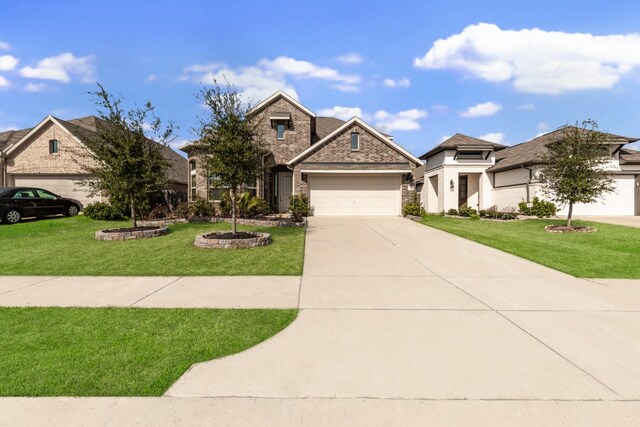 view of front of property with a garage and a front lawn