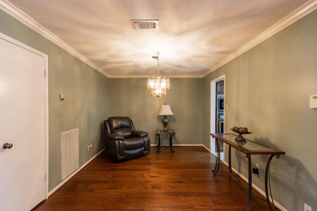 living area featuring ornamental molding, dark wood-type flooring, visible vents, and an inviting chandelier