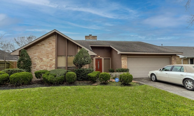 view of front of home with an attached garage, driveway, roof with shingles, a front lawn, and a chimney