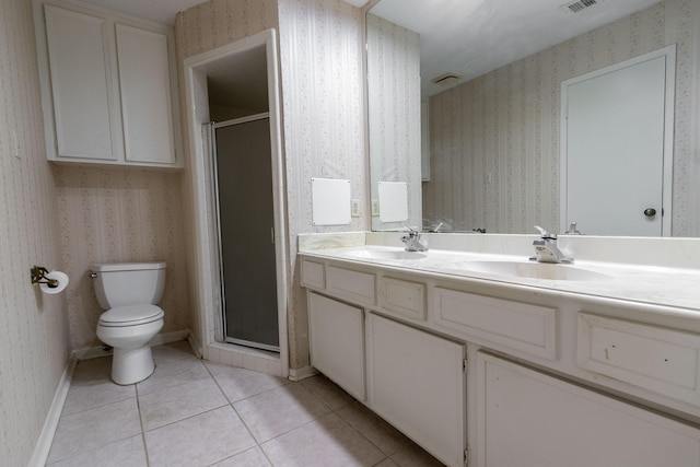 bathroom with tile patterned flooring, a sink, and wallpapered walls