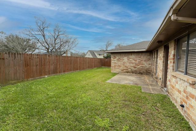 view of yard with a fenced backyard and a patio