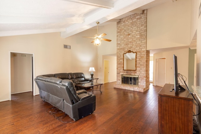 living room with a fireplace, visible vents, a ceiling fan, beamed ceiling, and dark wood finished floors