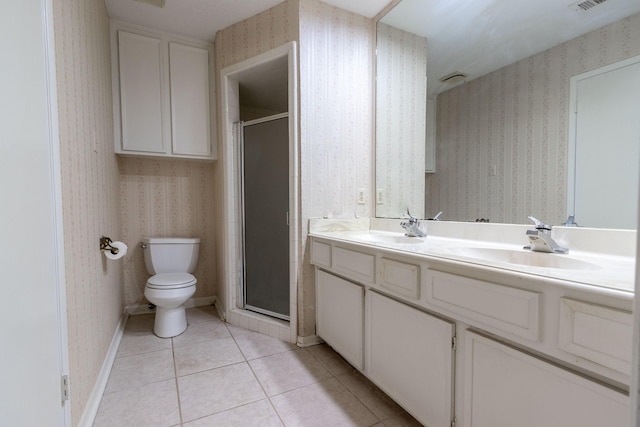 bathroom with a shower stall, tile patterned floors, a sink, and wallpapered walls