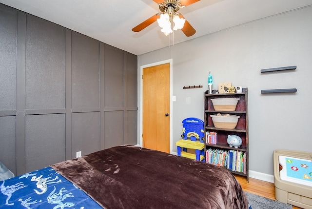 bedroom with hardwood / wood-style flooring and ceiling fan