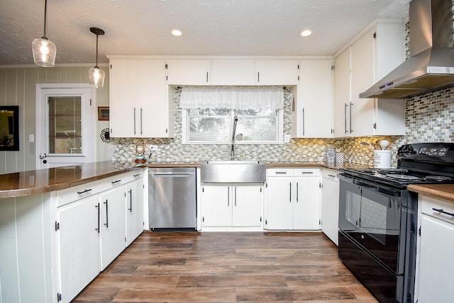 kitchen with white cabinetry, decorative light fixtures, stainless steel dishwasher, black range with electric cooktop, and wall chimney exhaust hood