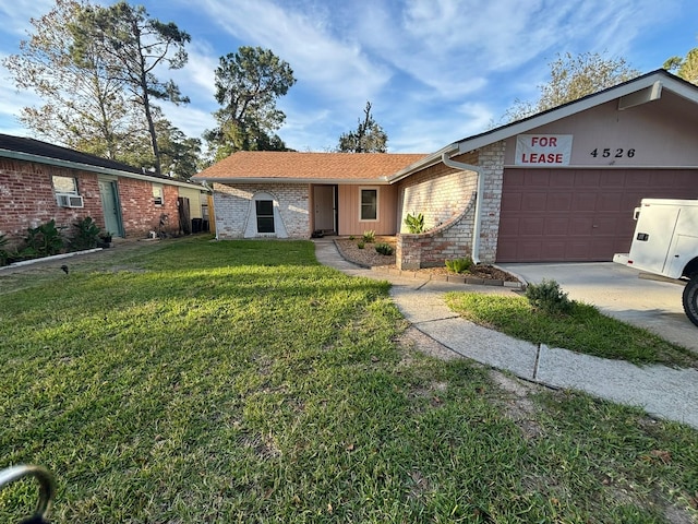 single story home with a front lawn and a garage