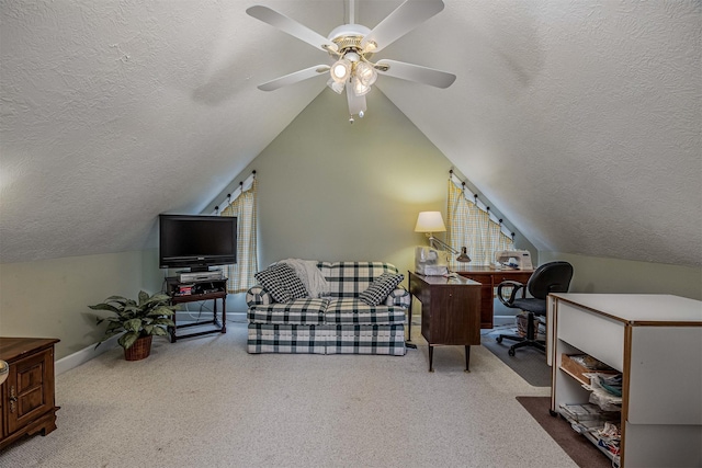 office space featuring lofted ceiling, a textured ceiling, carpet, and a ceiling fan